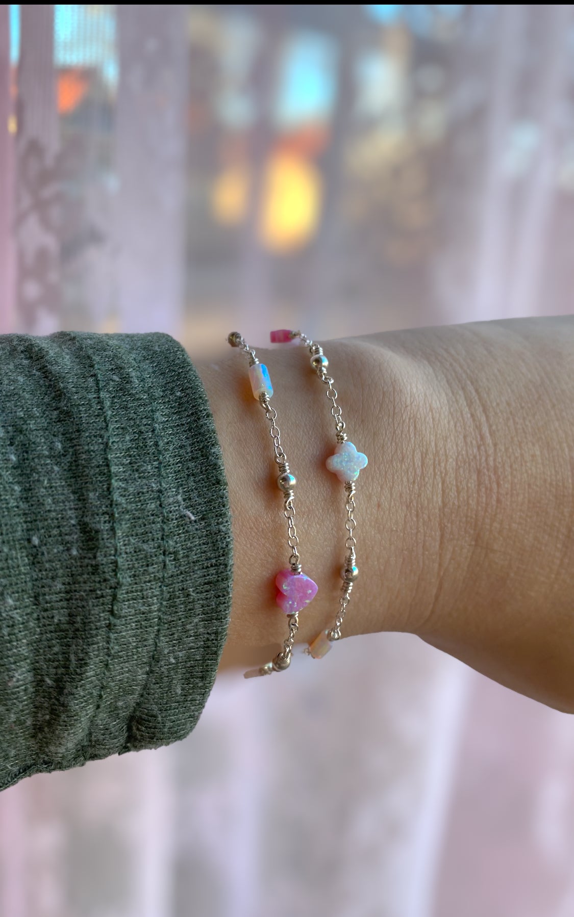 Handmade opal charm chain bracelet with iridescent gemstones, shown stacked on wrist for styling inspiration, available in gold filled and sterling silver