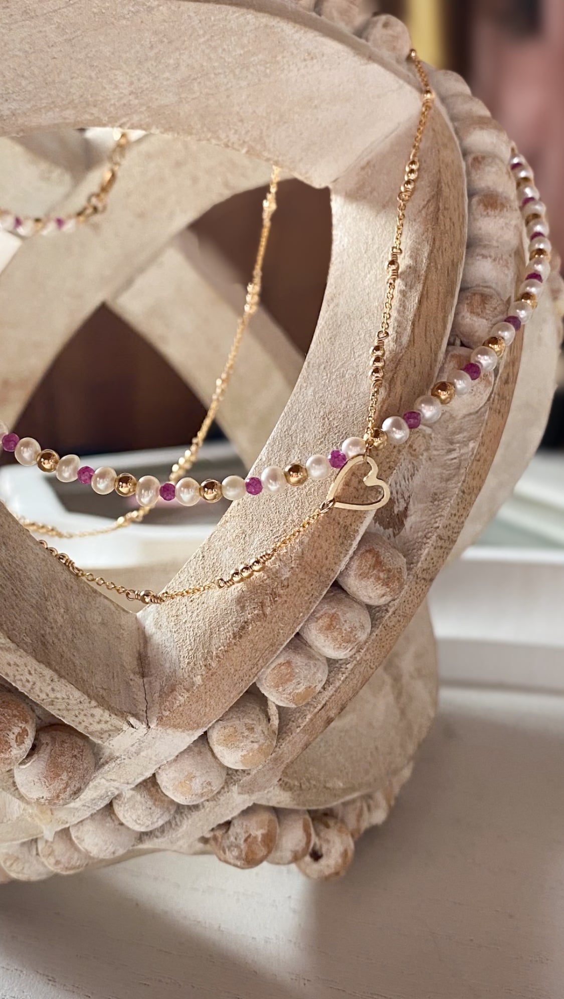 Necklace with beads on a decorative stone surface