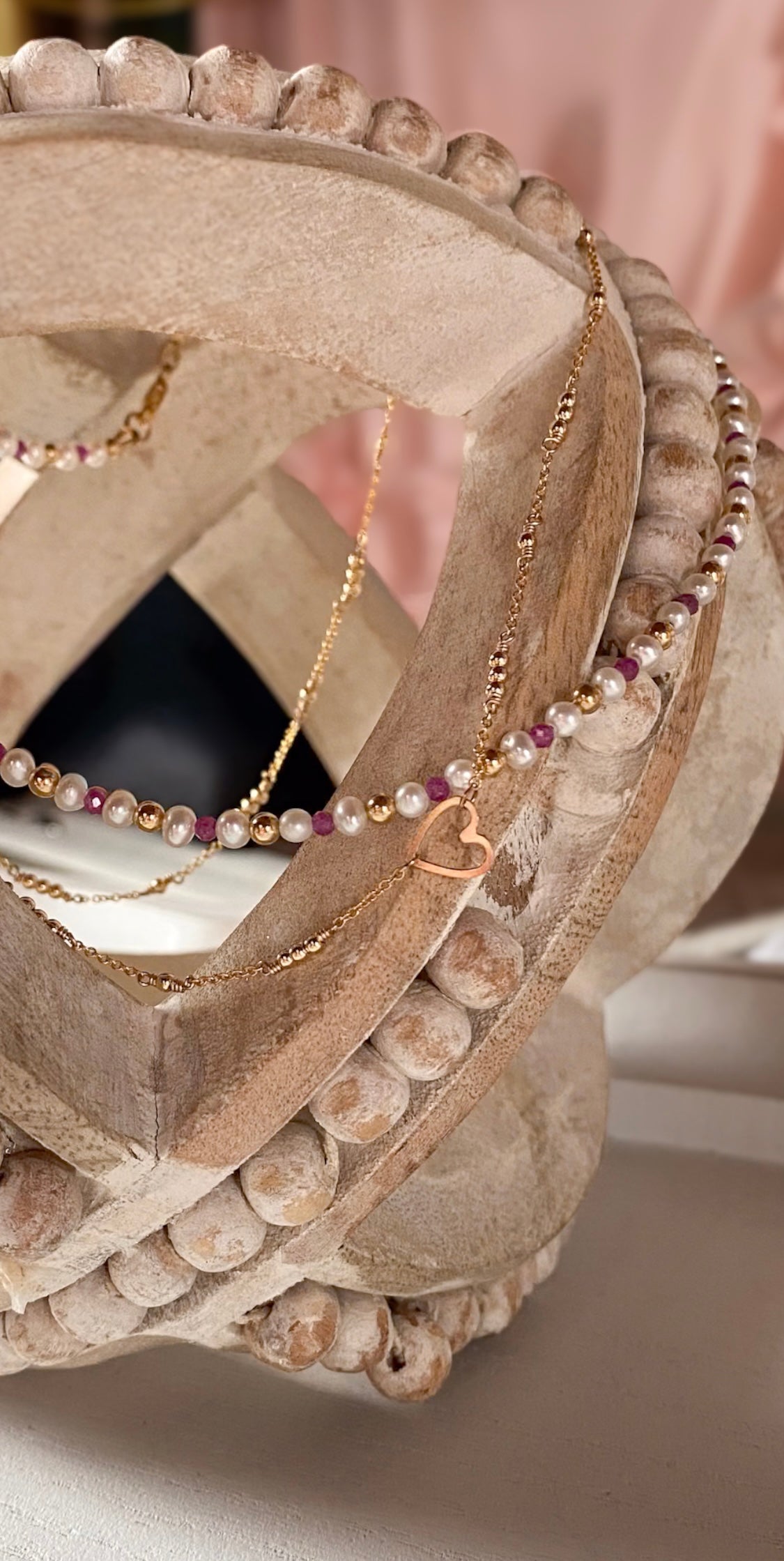 Necklaces on a decorative stone surface