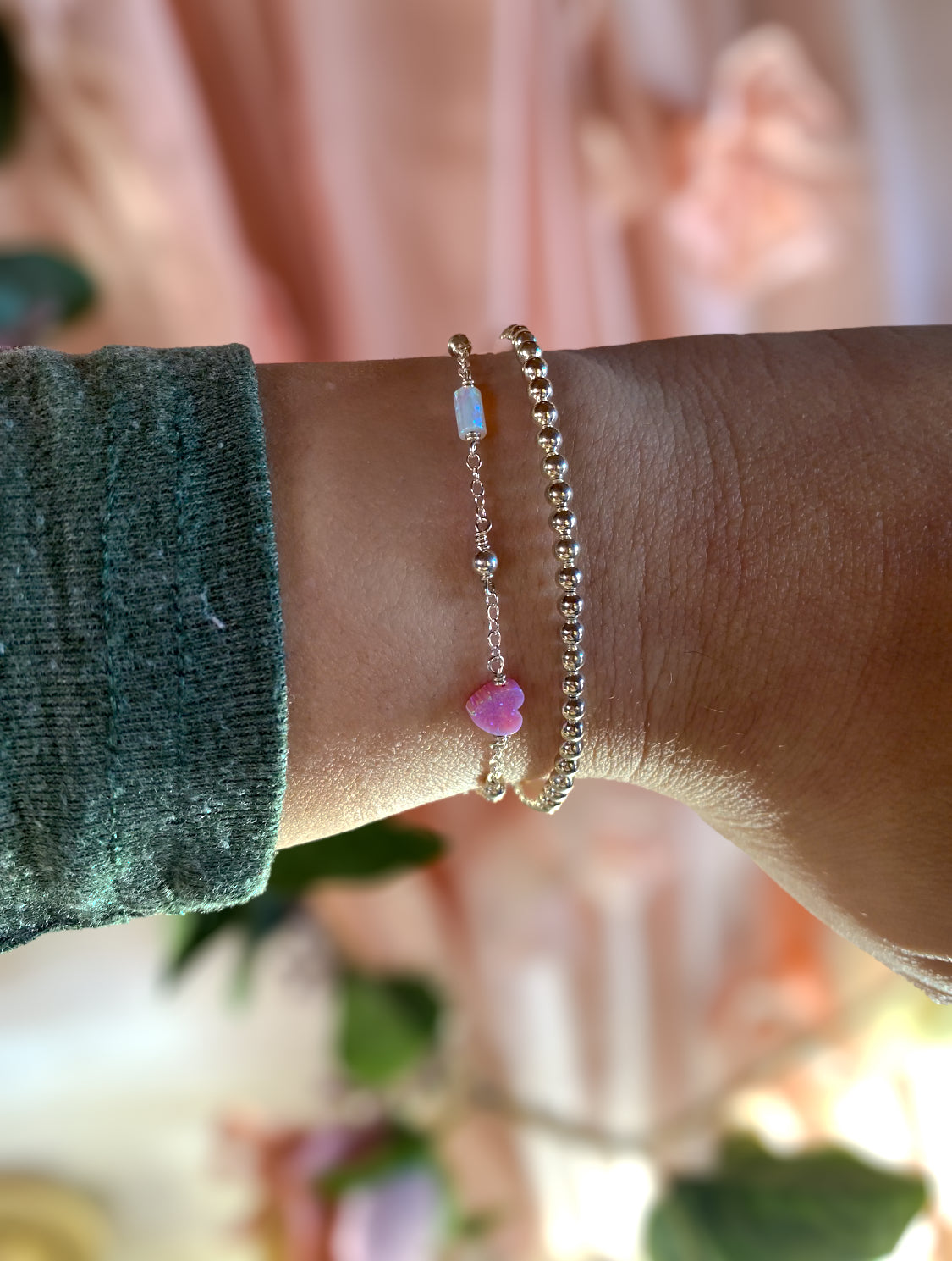 Handmade opal charm chain bracelet with iridescent gemstones, shown stacked on wrist for styling inspiration, available in gold filled and sterling silver