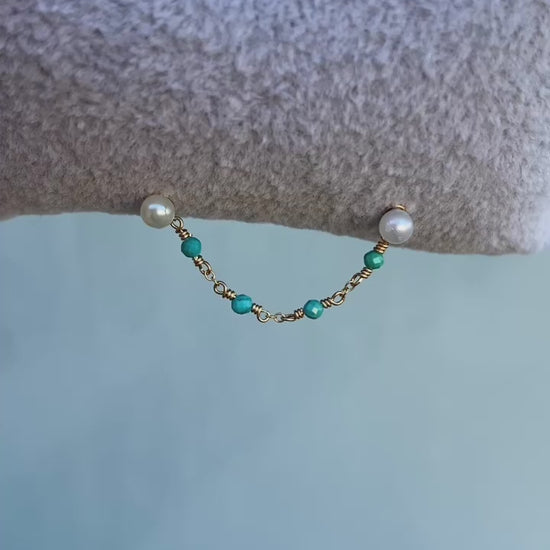 This chain is made with 14kt gold filled chain, and 2mm natural turquoise. 

SOLD AS A SINGLE 

Measures about 39mm not including jumprings ! 

Chains/Charms are the perfect way to add a little extra sparkle to your existing jewelry. ✨ They can be worn on post up to 16g. Just be sure your post has enough length to fit the extra detail. Easy to wear, effortless to style, and totally you.

SOLD AS A SINGLE - CHAINS ONLY - Earring and Earring post sold separately. Earring in video and pictures are for display 