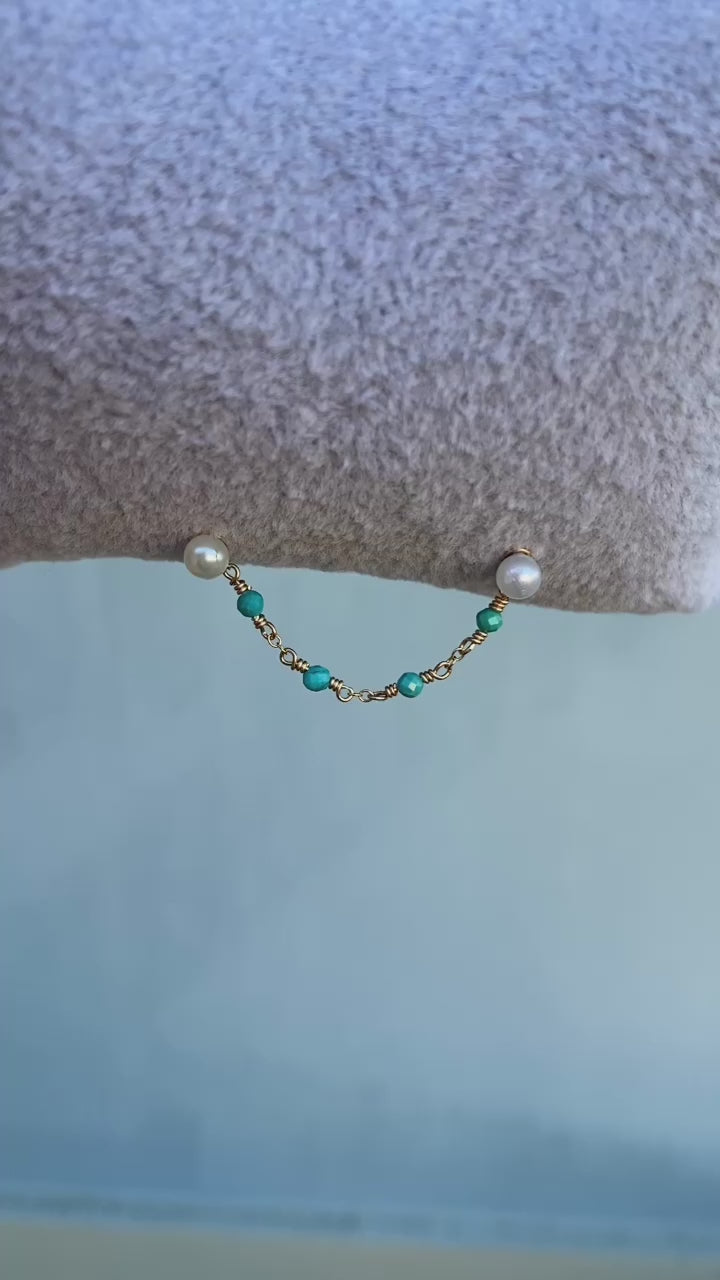 This chain is made with 14kt gold filled chain, and 2mm natural turquoise. 

SOLD AS A SINGLE 

Measures about 39mm not including jumprings ! 

Chains/Charms are the perfect way to add a little extra sparkle to your existing jewelry. ✨ They can be worn on post up to 16g. Just be sure your post has enough length to fit the extra detail. Easy to wear, effortless to style, and totally you.

SOLD AS A SINGLE - CHAINS ONLY - Earring and Earring post sold separately. Earring in video and pictures are for display 